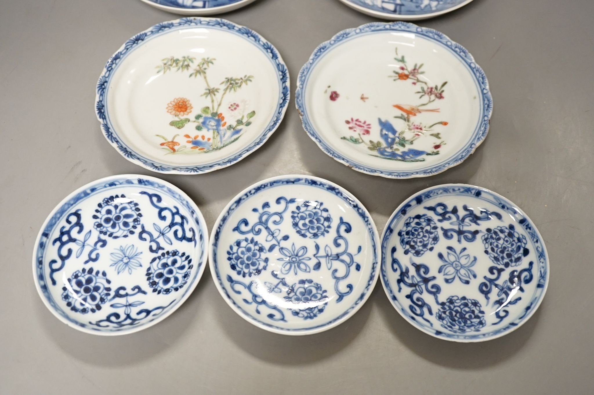 Seven 18th century Chinese saucer dishes, largest 14 cms diameter.